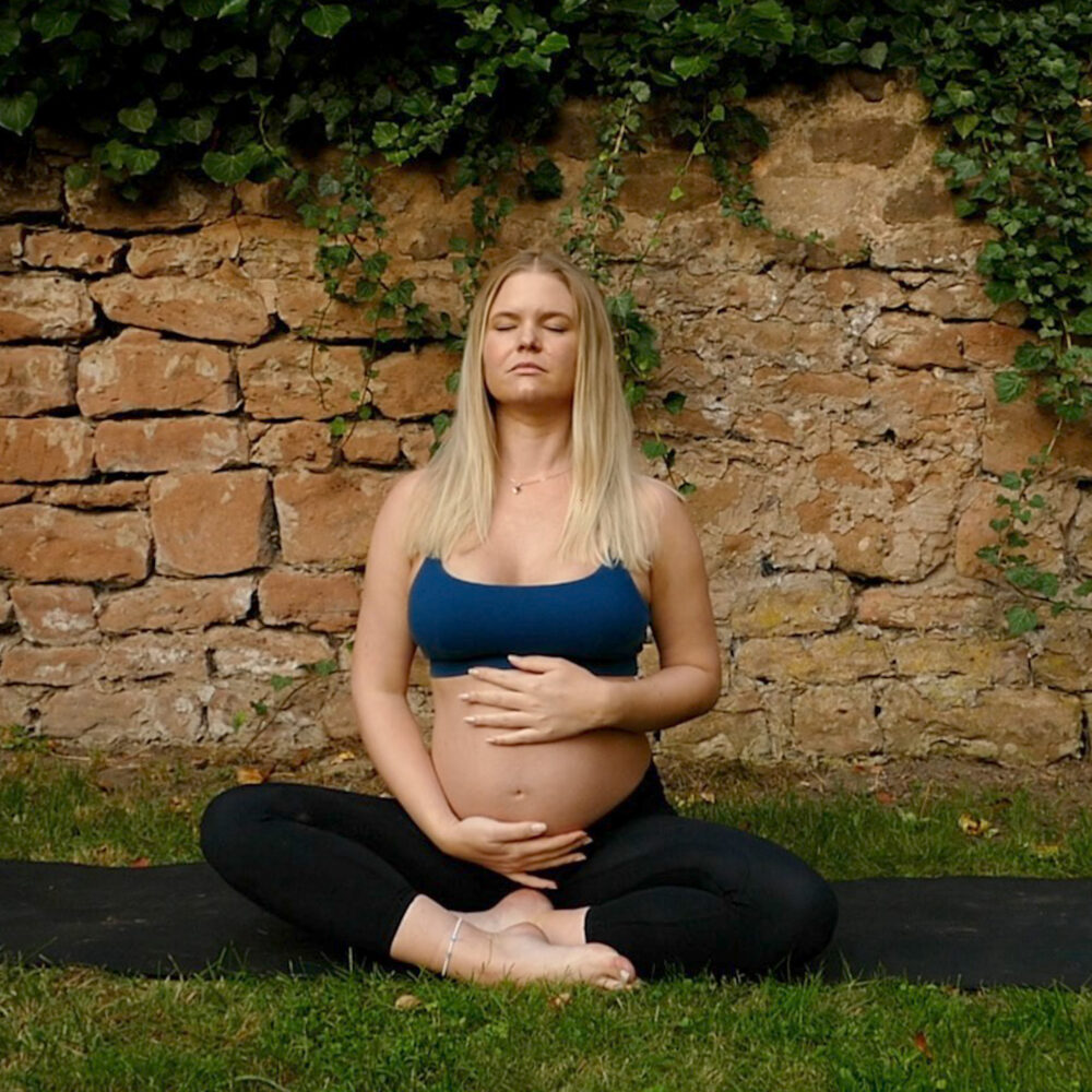 Blonde pregnant Woman doing goddess yoga pose, Prenatal Yoga